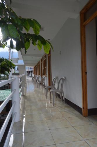 a row of chairs lined up in a hallway at Hotel Xetawaa´l in San Pedro La Laguna