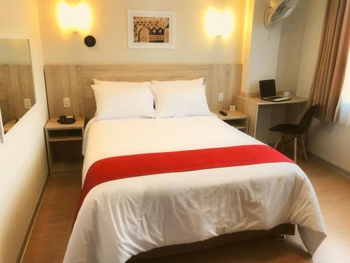 Voodi või voodid majutusasutuse Hotel San Remo toas