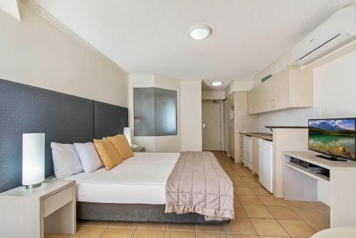 a hotel room with a bed and a tv at BreakFree Alexandra Beach in Alexandra Headland