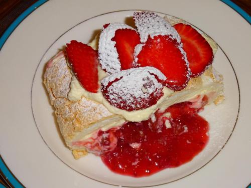 a white plate with a strawberry dessert on it at Muddy Creek Cutting in Lauder