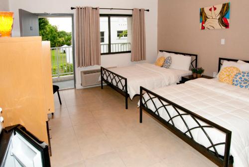 Postel nebo postele na pokoji v ubytování Shalimar Motel