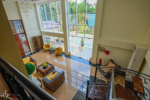 an overhead view of a living room with a staircase at Balai Carmela in Tuguegarao City