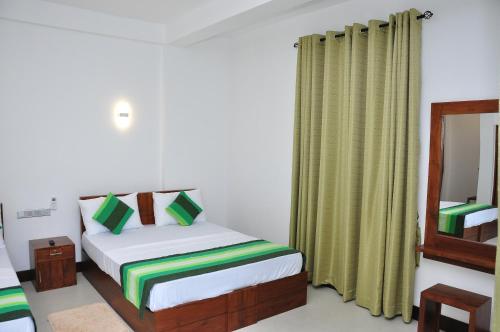 Postel nebo postele na pokoji v ubytování Green View Resort - Anuradhapura