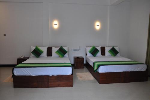 Postel nebo postele na pokoji v ubytování Green View Resort - Anuradhapura