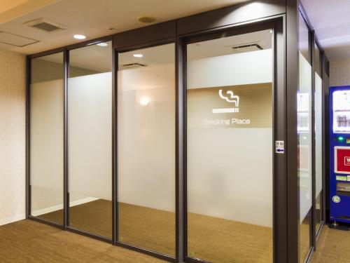 a sliding glass door in a building at Hotel Merieges in Miyazaki