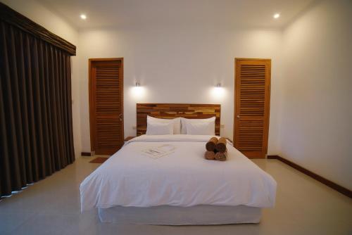 Tempat tidur dalam kamar di Ibludan Hotel