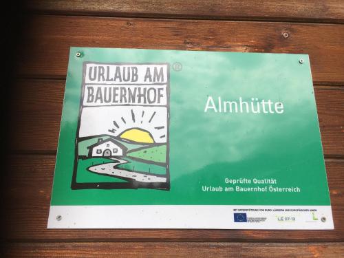 a book on the side of a wooden wall at Obere Roner Kasa in Mörtschach