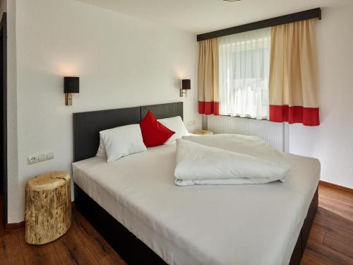 A bed or beds in a room at A CASA Opal Appartements