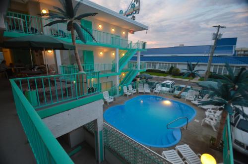 a hotel with a swimming pool on the side of a building at Sea Scape Inn - A Fine Family Destination in Wildwood Crest
