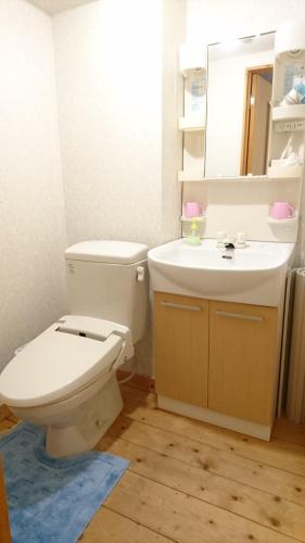 a bathroom with a toilet and a sink at Weekly Mansion Ise No.6 in Ise