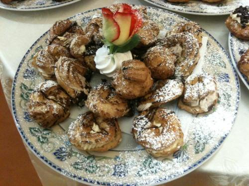 a plate of donuts on a table with at Savant Hotel in Lamezia Terme