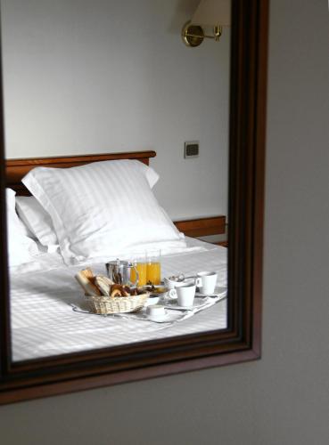 Ένα ή περισσότερα κρεβάτια σε δωμάτιο στο Auberge des Pins - Teritoria