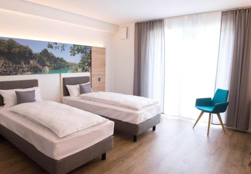 Ένα ή περισσότερα κρεβάτια σε δωμάτιο στο Boardinghouse am Teuto