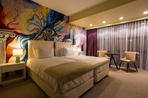Una cama o camas en una habitación de Ganzo Boutique Hotel