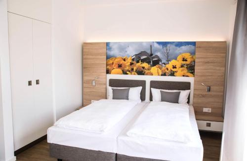 Ένα ή περισσότερα κρεβάτια σε δωμάτιο στο Boardinghouse am Teuto