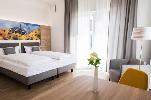 Ένα ή περισσότερα κρεβάτια σε δωμάτιο στο Boardinghouse am Teuto