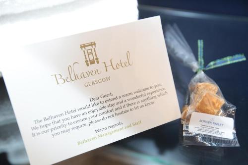 a sign for a box of belmondega halued food at The Belhaven Hotel in Glasgow