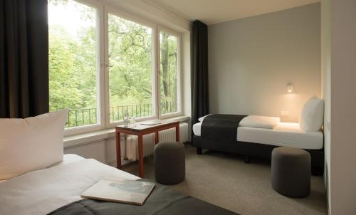 Postel nebo postele na pokoji v ubytování Hotel Christophorus