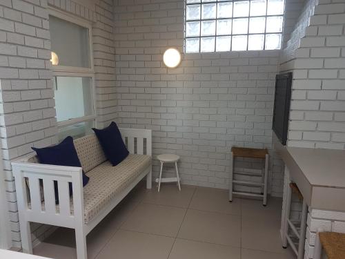 a living room with a couch and a window at South Point Guest Lodge in Agulhas