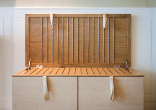 a wooden bench in a room with a wall at Amari Hua Hin in Hua Hin