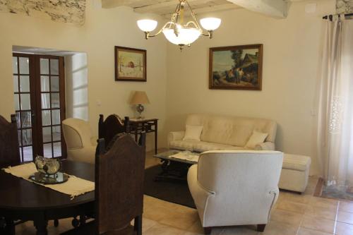 a living room with a couch and a table at Agroturismo Casal de Castro in Mirandela
