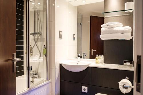 a bathroom with a sink and a shower at The Princess Royal in Farnham