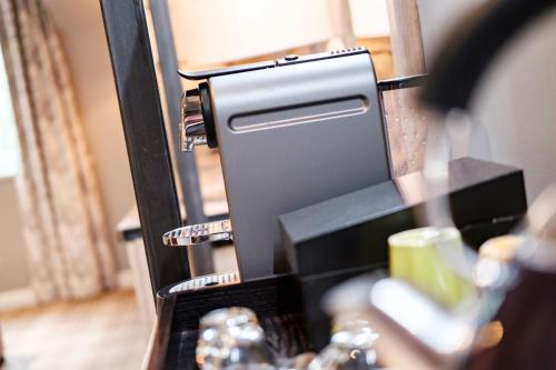a close up of a counter with a mirror at The Princess Royal in Farnham