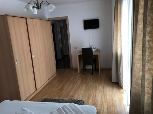 Ένα ή περισσότερα κρεβάτια σε δωμάτιο στο Hotel Nova Residence