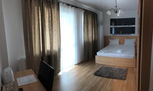 Ένα ή περισσότερα κρεβάτια σε δωμάτιο στο Hotel Nova Residence