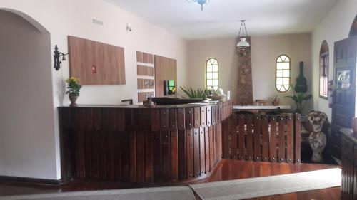 a kitchen with a wooden fence in a room at Pousada da Seresta in Diamantina