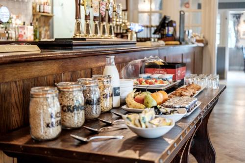 a table with various food items on it at The Princess Royal in Farnham