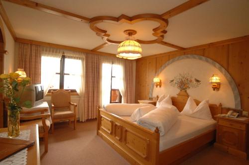 Postel nebo postele na pokoji v ubytování Hotel Neuwirt
