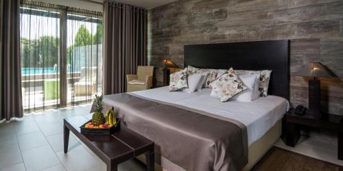 Кровать или кровати в номере Dion Palace Resort and Spa