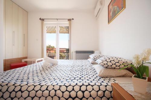 Postel nebo postele na pokoji v ubytování Guesthouse Marta