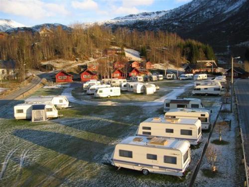 a bunch of rvs parked in a parking lot at Røldal Hyttegrend & Camping in Røldal