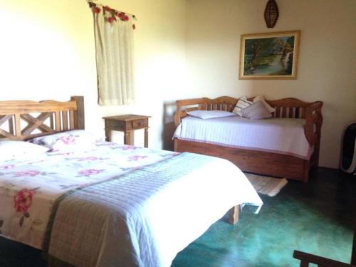 Postel nebo postele na pokoji v ubytování Pousada Encantos do Cerrado