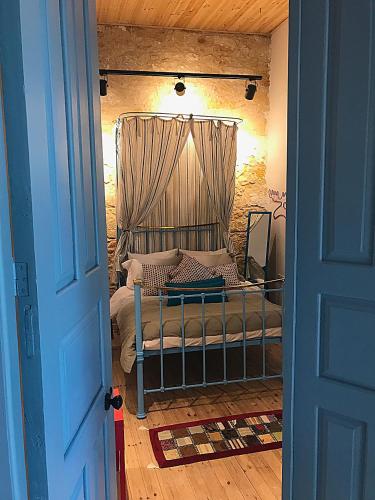 a bedroom with a bed with a canopy at TasEV Guesthouse in North Nicosia