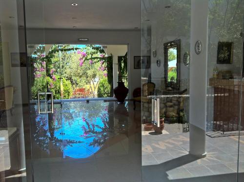a room with a swimming pool in a house at Castellania Hotel Apartments in Livadia