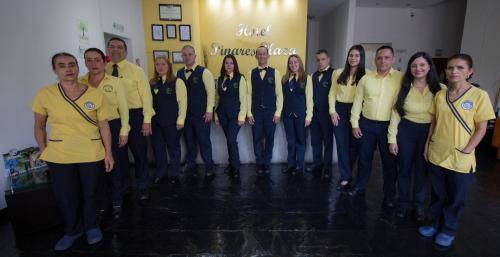 a group of people are posing for a picture at Hotel Pinares Plaza in Pereira