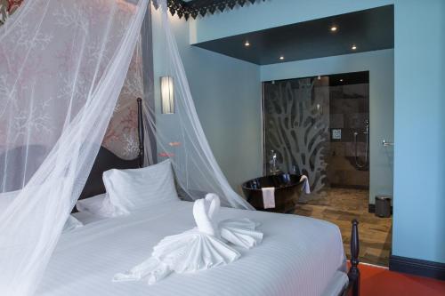 Postel nebo postele na pokoji v ubytování Villa Delisle Hôtel & Spa