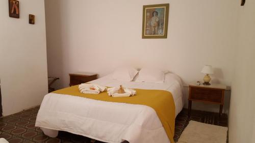 Кровать или кровати в номере Antigua Fonda Hosteria