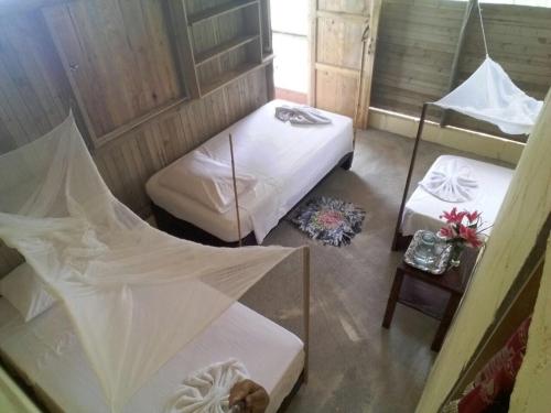 Ecolodge Mar y Rioにあるベッド