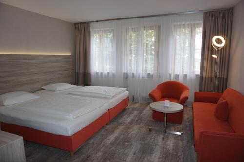 Ένα ή περισσότερα κρεβάτια σε δωμάτιο στο Hotel Kastanienhof
