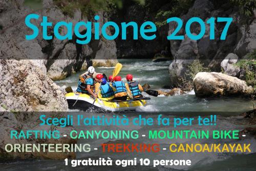 a group of people in a raft on a river at B&B Via Roma in Viggianello