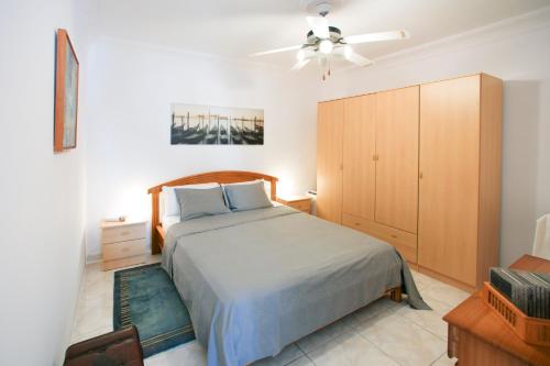 a bedroom with a bed and a ceiling fan at Costa del Silencio Apartment in Costa Del Silencio