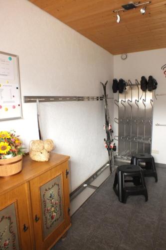 a room with a gym with a wall with equipment at Haus Schneeflocke in Lech am Arlberg