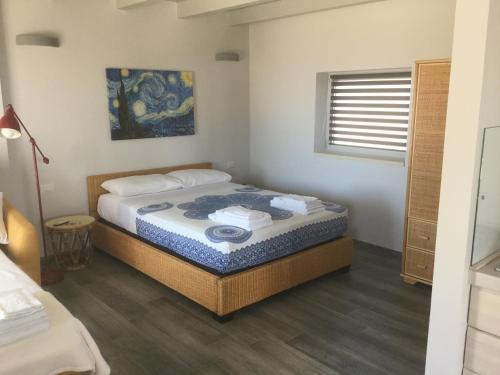 モルチャーノ・ディ・レウカにあるVilla Cà del Marの部屋にベッドがある寝室
