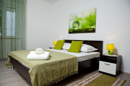 Postel nebo postele na pokoji v ubytování Apartman u srcu grada - Ilićev prolaz