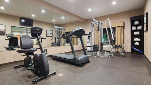 a gym with several exercise equipment in a room at Sonesta Essential Indianapolis Airport in Plainfield