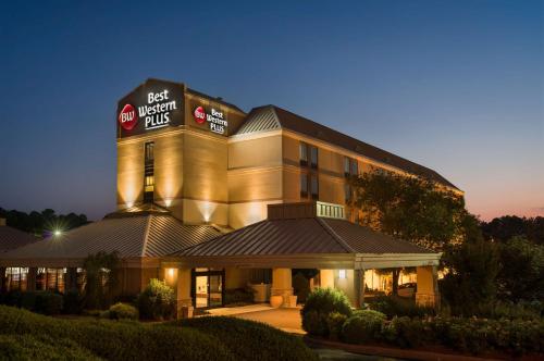 a hotel with a sign on the top of a building at Best Western Plus Goldsboro in Goldsboro